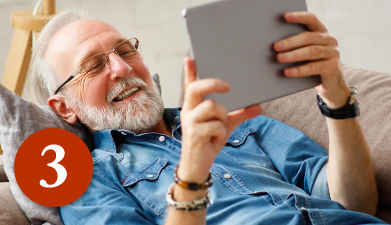 Image of an older man using an online dating website